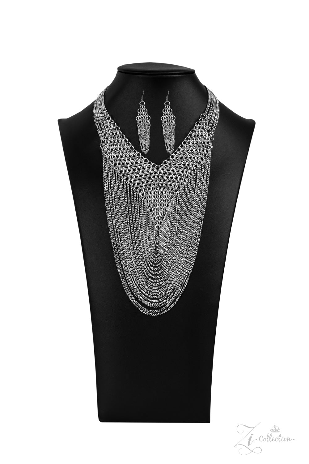 Item #Z2012 Suspended from the bottom of thickly layered chains, a rebellious mesh of silver links connect into an edgy V-shaped net. Tiers of dainty silver chains drape from the bottom of the net, creating radically layered shimmer across the chest. Features an adjustable clasp closure. Sold as one individual necklace. Includes one pair of matching earrings. New Kit