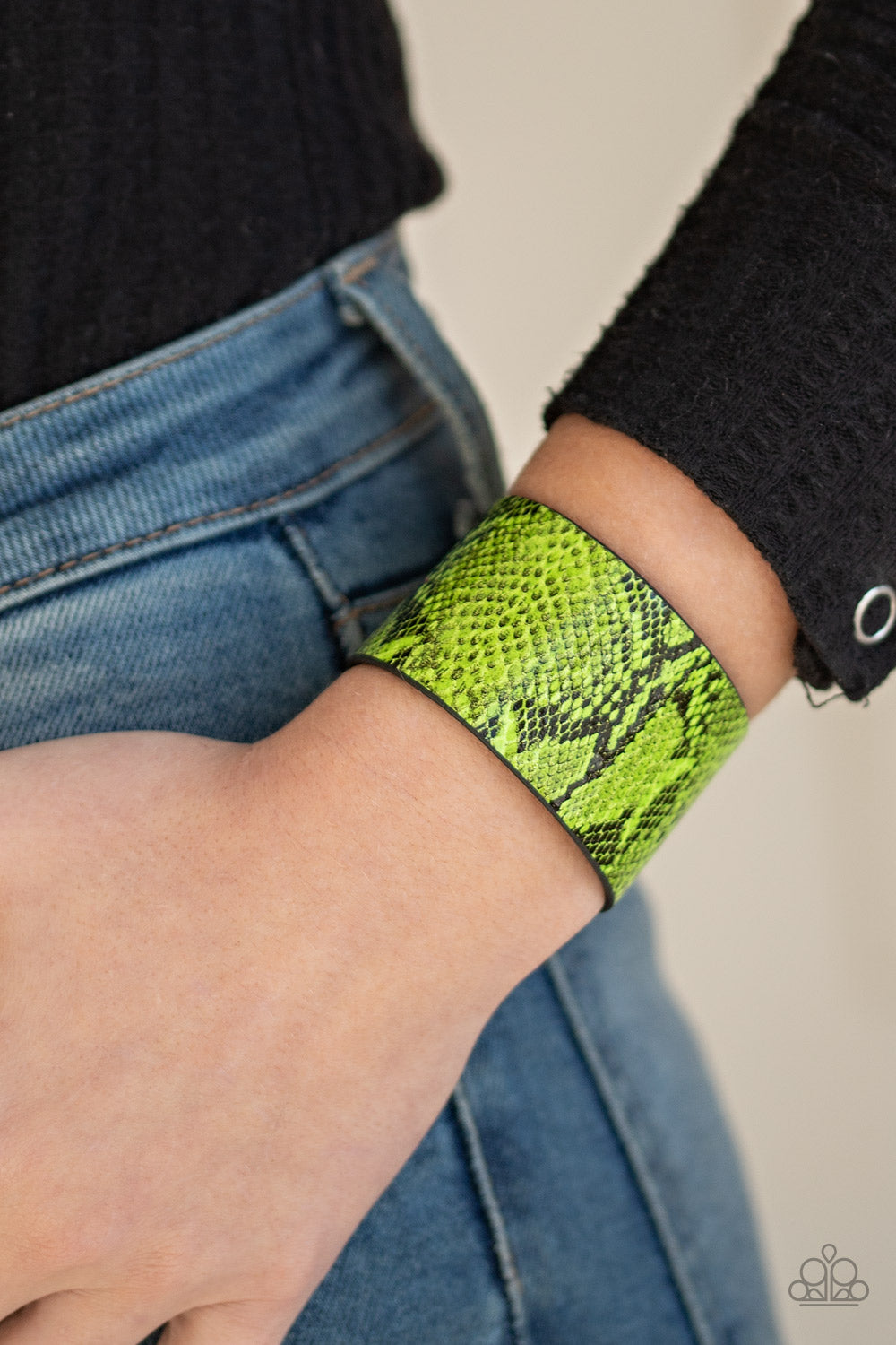 Item #P9SE-URGR-146XX Featuring neon green python print, a thick leather band wraps around the wrist for a colorfully wild look. Features an adjustable snap closure. Sold as one individual bracelet.