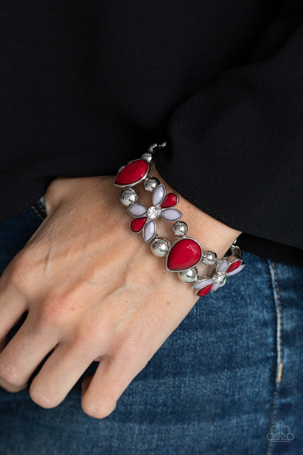 Item #P9WH-RDXX-137XX Featuring wine and Paloma beaded petals, white rhinestone dotted floral frames, shiny silver beads, and faceted wine teardrop beads are threaded along stretchy bands around the wrist for a glamorous look. Sold as one individual bracelet.