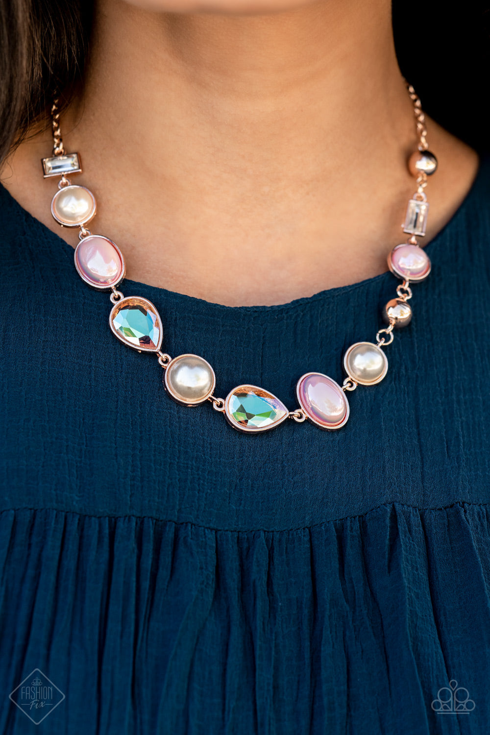 A collection of classic white pearls, Pale Rosette pearls glazed in a reflective finish, and iridescent teardrops wrap around the wrist in an ethereal display. Rose gold frames encase each bead, adding a romantic vibe to the vintage inspired design. Features an adjustable clasp closure. Sold as one individual bracelet.