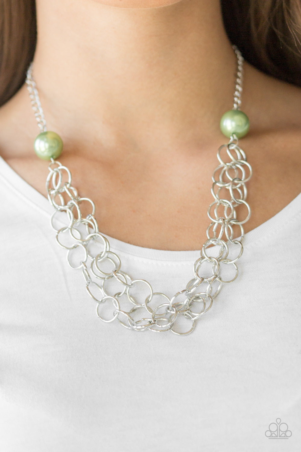 Item #P2IN-GRXX-040XX Two oversized green pearls give way to dramatic silver chains, creating bold layers below the collar for a sassy look. Features an adjustable clasp closure. Sold as one individual necklace. Includes one pair of matching earrings.
