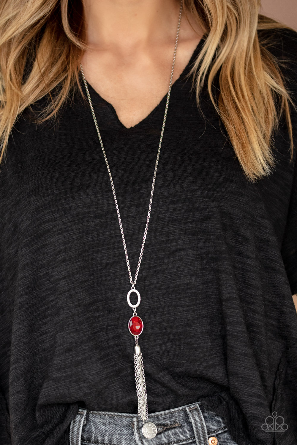 Item #P2RE-RDXX-165SB A white rhinestone encrusted ring, oval red rhinestone, and shimmery silver chain tassel dangles from the bottom of a lengthened silver chain, creating a glamorous statement. Features an adjustable clasp closure. Sold as one individual necklace. Includes one pair of matching earrings.