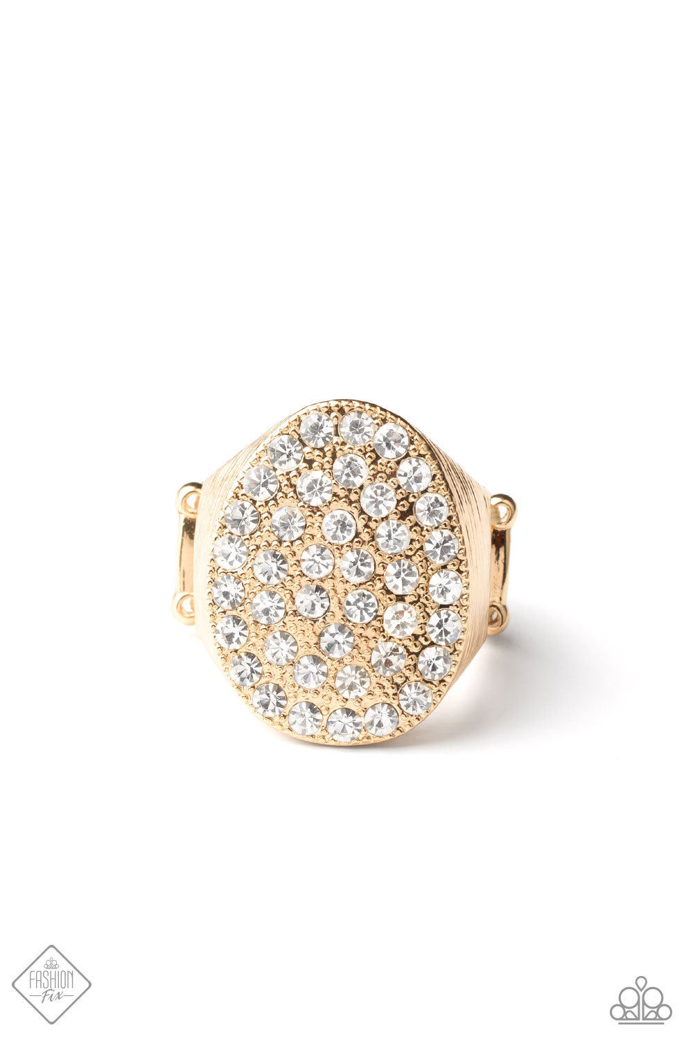 Item #P4ED-GDXX-034XJ The front of a golden oval frame is haphazardly encrusted in a blinding scatter of glassy white rhinestones, creating a dramatic centerpiece atop the finger. Features a stretchy band for a flexible fit. Sold as one individual ring. New Kit Fashion Fix