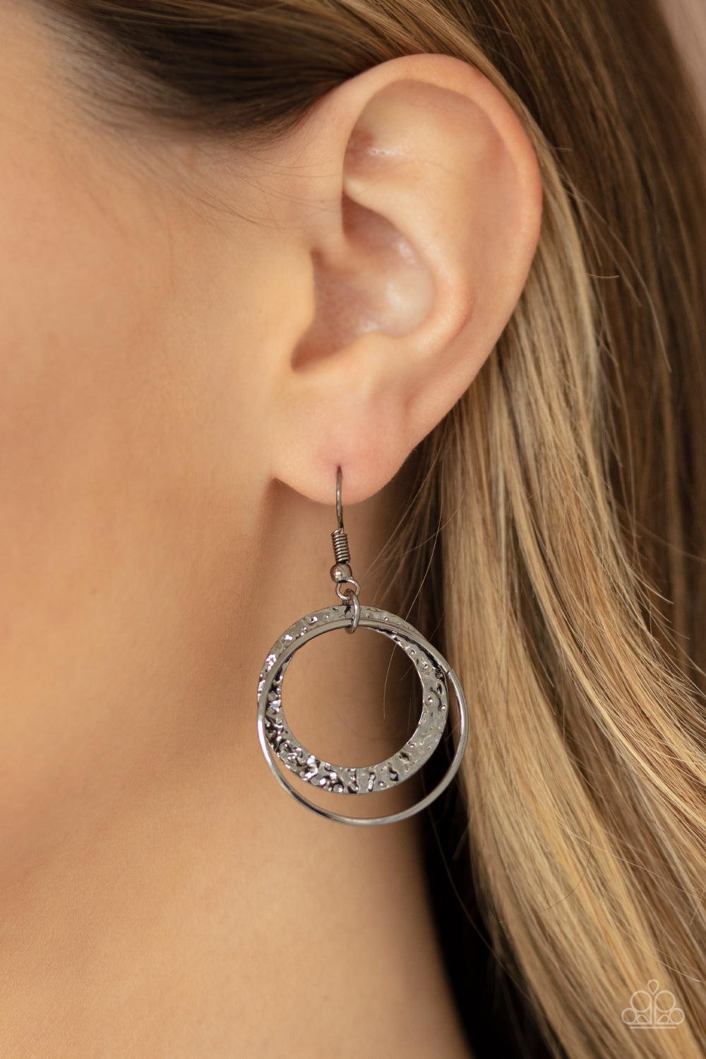 Item #P2ST-BKXX-122XX Hammered and embossed in a foil-like finish, a gunmetal moon-like frame bows below the collar. Dainty gunmetal hoops and matching hammered rings cascade from the bottom, creating an edgy fringe. Features an adjustable clasp closure. Sold as one individual necklace. Includes one pair of matching earrings.