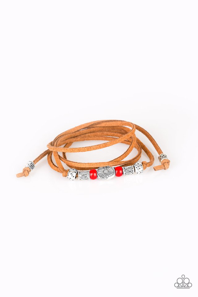 An array of red and silver beads are knotted in place along elongated suede cording for a wanderlust fashion. To secure bracelet, tie ends in place around the wrist at desired length.  Sold as one individual bracelet.