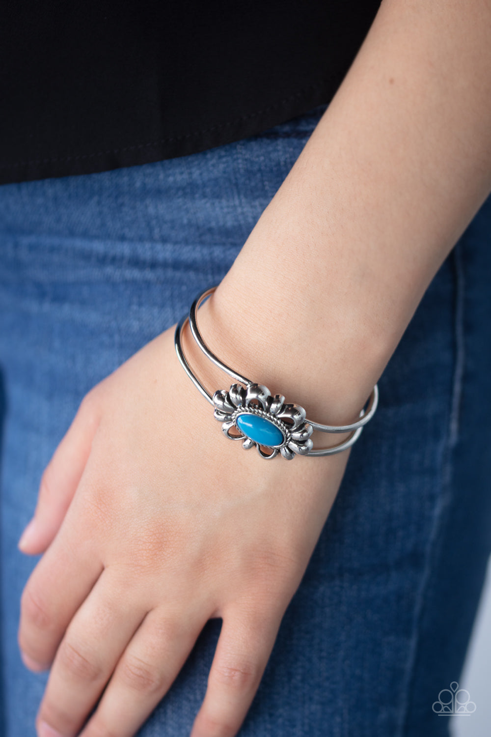 Item #P9DA-BLXX-080XX A refreshing Mosaic Blue bead is pressed into the center of a shiny silver floral frame atop an airy silver cuff, creating a whimsical centerpiece. Features a hinged closure.  Sold as one individual bracelet.