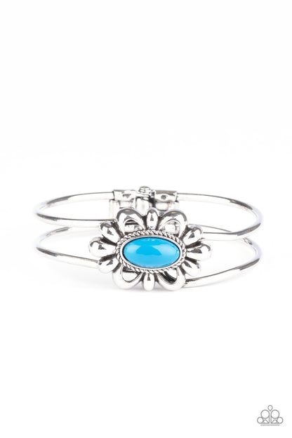 Item #P9DA-BLXX-080XX A refreshing Mosaic Blue bead is pressed into the center of a shiny silver floral frame atop an airy silver cuff, creating a whimsical centerpiece. Features a hinged closure.  Sold as one individual bracelet.